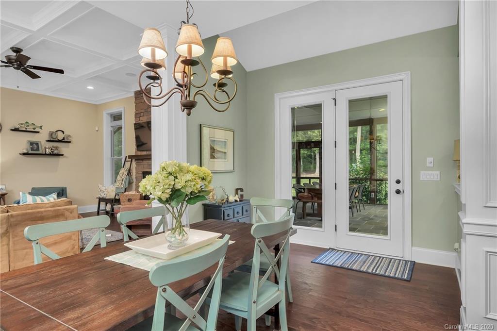 1401 Delaney Drive Weddington, NC 28104 - Photo 16 of 48 a view of a dining room with furniture wooden floor and chandelier
