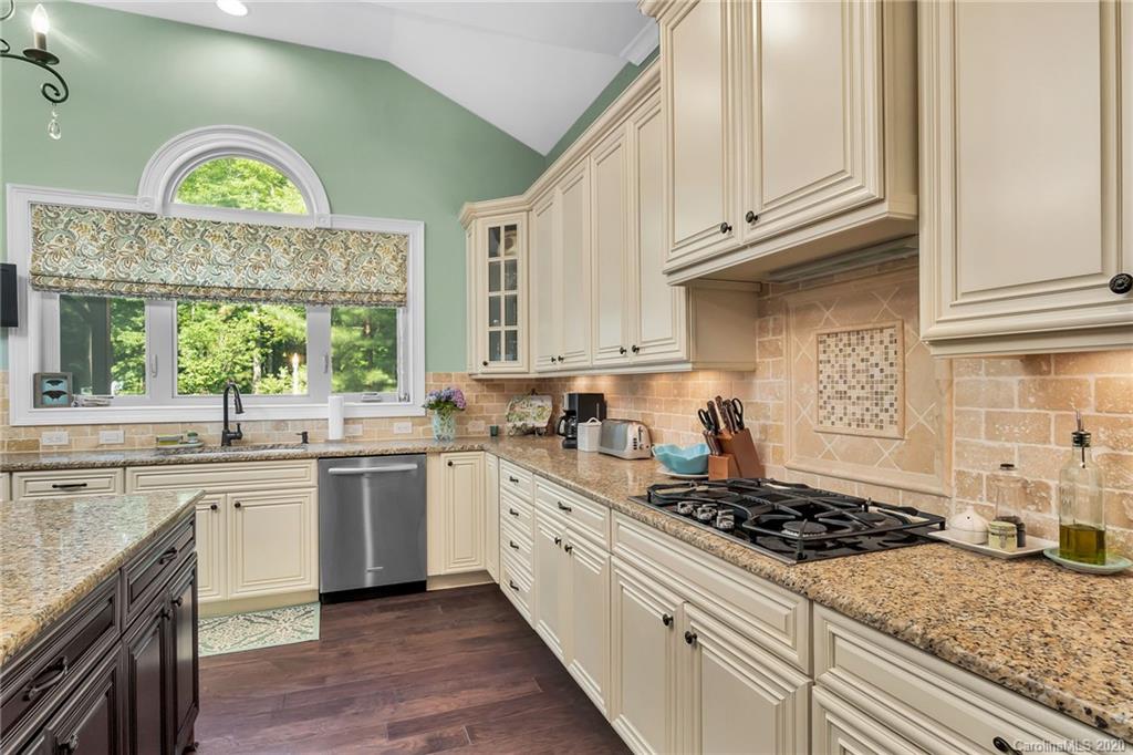 1401 Delaney Drive Weddington, NC 28104 - Photo 21 of 48 a kitchen with a stove a sink and a window