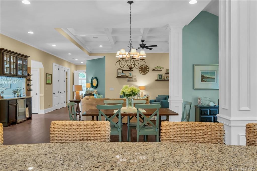 1401 Delaney Drive Weddington, NC 28104 - Photo 22 of 48 a living room with furniture and a chandelier