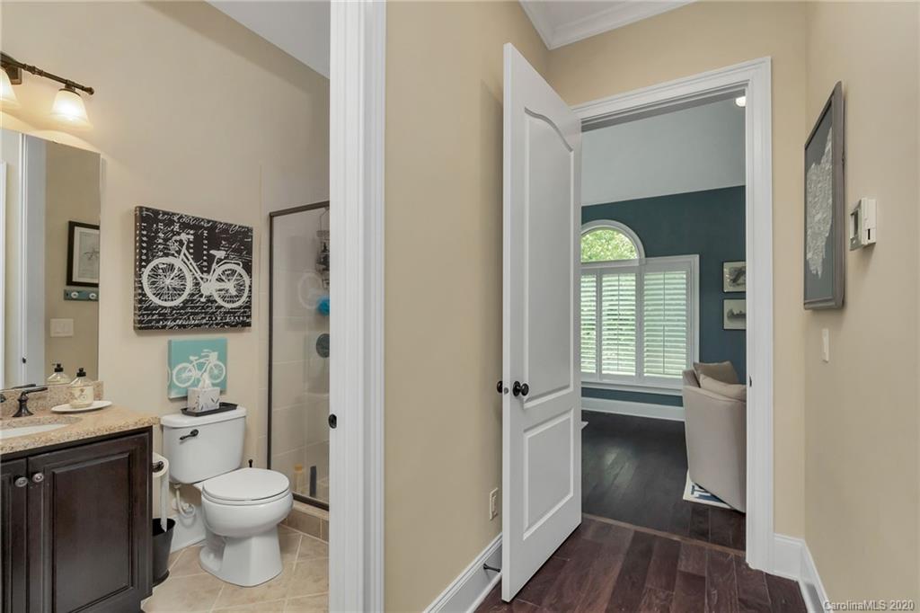 1401 Delaney Drive Weddington, NC 28104 - Photo 24 of 48 a bathroom with a toilet sink and vanity
