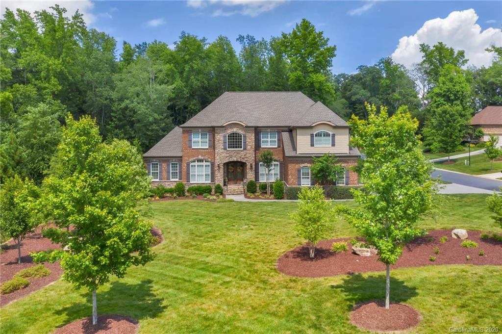 1401 Delaney Drive Weddington, NC 28104 - Photo 4 of 48 a front view of a house with a yard and a garden