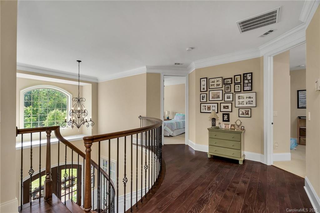 1401 Delaney Drive Weddington, NC 28104 - Photo 37 of 48 a view of front door with wooden floor and stairs
