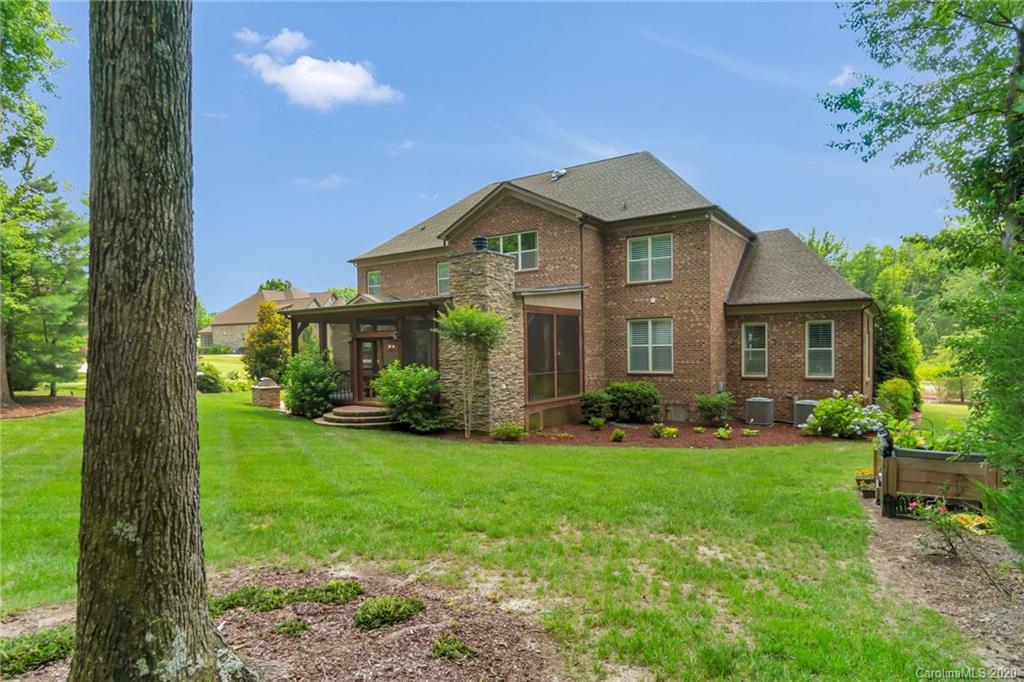 1401 Delaney Drive Weddington, NC 28104 - Photo 40 of 48 a front view of a house with garden