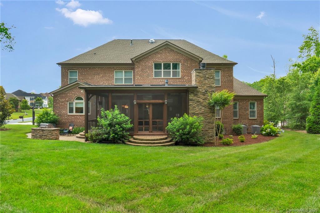 1401 Delaney Drive Weddington, NC 28104 - Photo 41 of 48 a front view of a house with a yard and porch