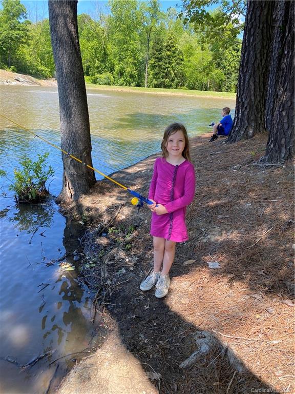 1401 Delaney Drive Weddington, NC 28104 - Photo 46 of 48 a view of a wooden fence with a bench in the patio