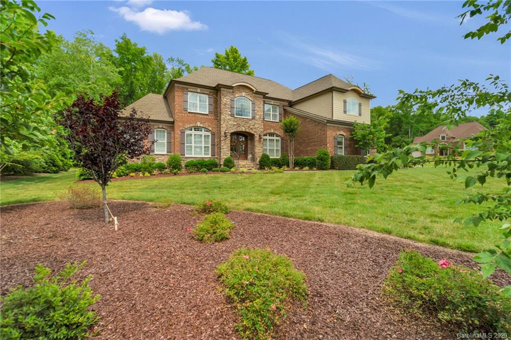 1401 Delaney Drive Weddington, NC 28104 - Photo 6 of 48 a front view of a house with a yard and garage
