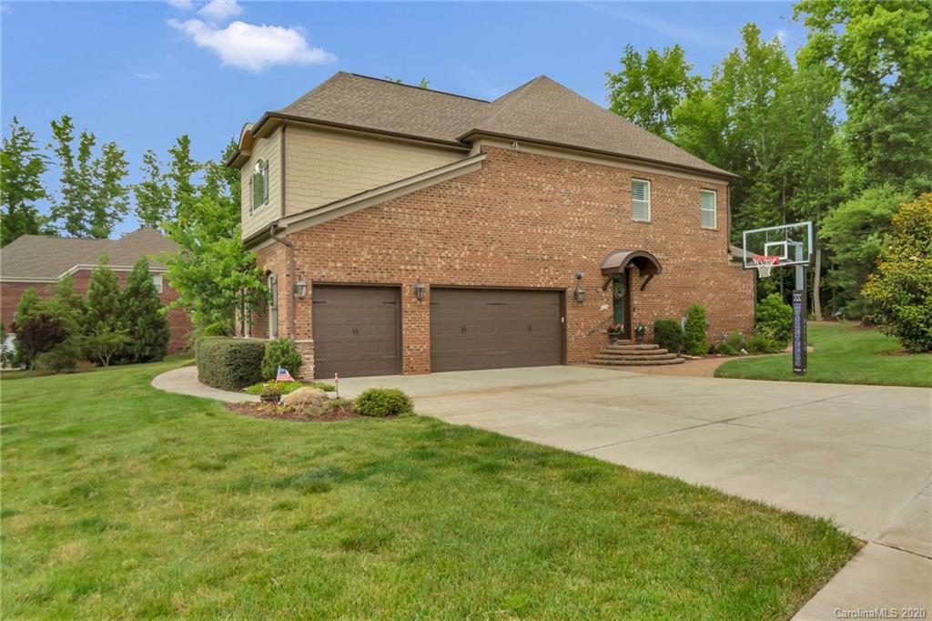 1401 Delaney Drive Weddington, NC 28104 - Photo 8 of 48 a front view of a house with a yard and garage