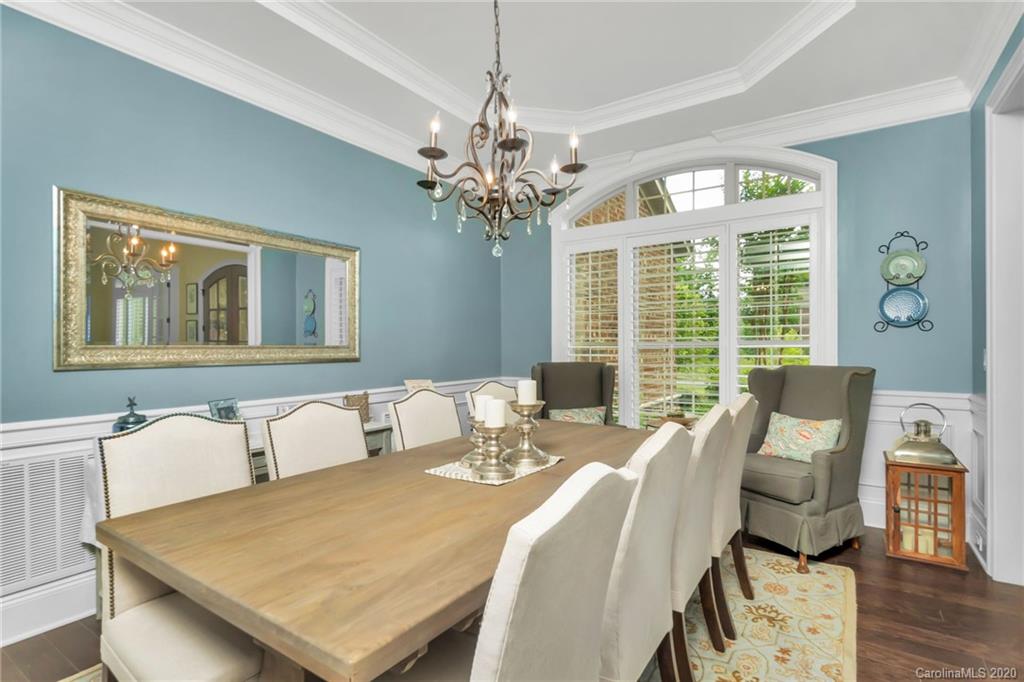 1401 Delaney Drive Weddington, NC 28104 - Photo 10 of 48 a view of a dining room with furniture wooden floor and chandelier