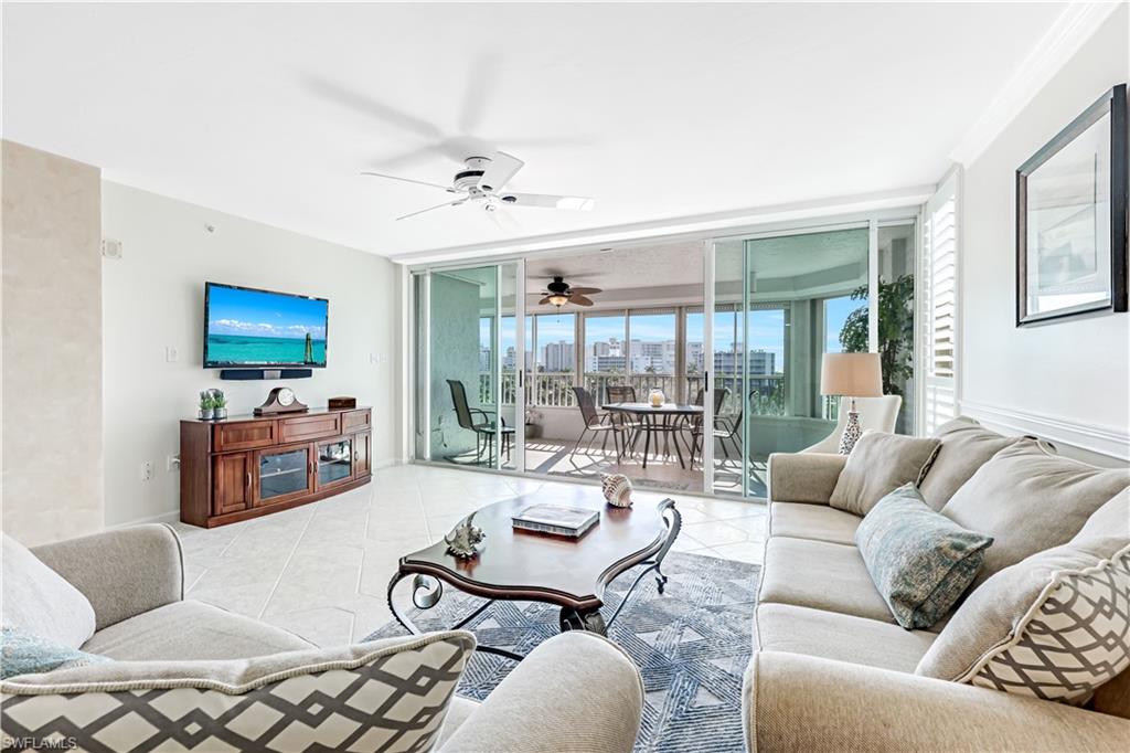 21 Bluebill Avenue, Unit B503 Naples, FL 34108 - Photo 13 of 40 a living room with furniture and a flat screen tv
