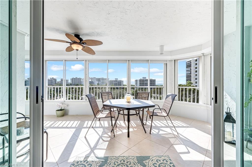 21 Bluebill Avenue, Unit B503 Naples, FL 34108 - Photo 28 of 40 a view of a dining room with furniture window and outside view