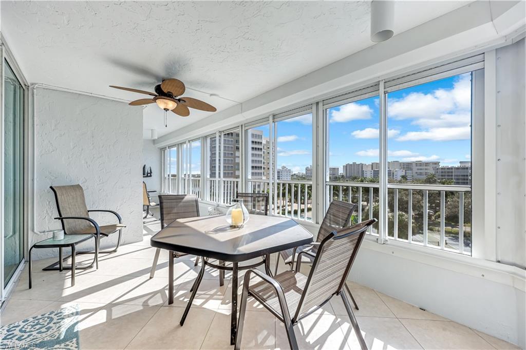 21 Bluebill Avenue, Unit B503 Naples, FL 34108 - Photo 29 of 40 a view of a dining room with furniture window and outside view