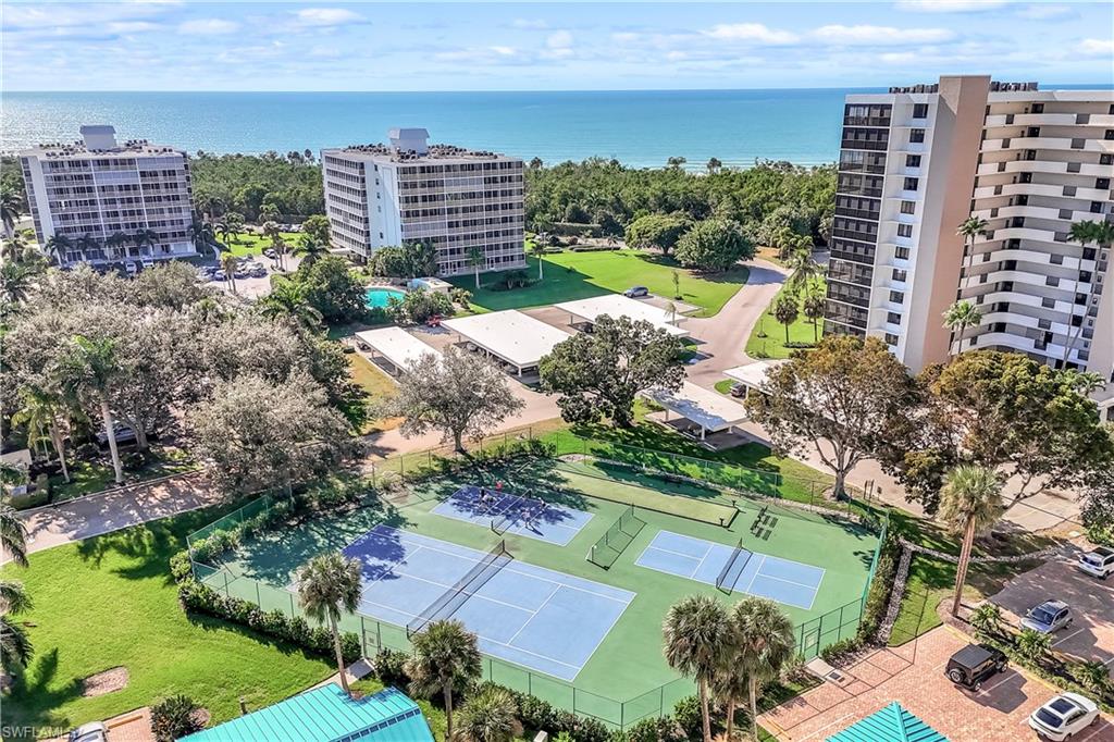 21 Bluebill Avenue, Unit B503 Naples, FL 34108 - Photo 3 of 40 a view of a city with tall buildings