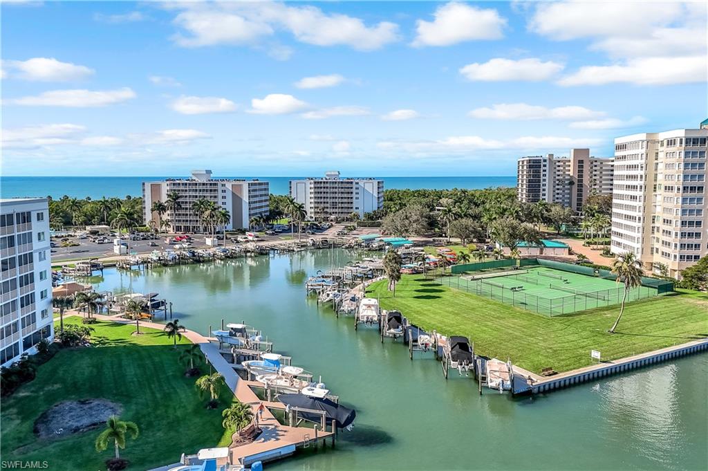 21 Bluebill Avenue, Unit B503 Naples, FL 34108 - Photo 37 of 40 a view of a lake with a city