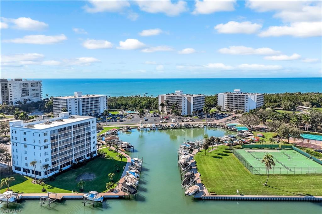 21 Bluebill Avenue, Unit B503 Naples, FL 34108 - Photo 38 of 40 a view of a city with lawn chairs