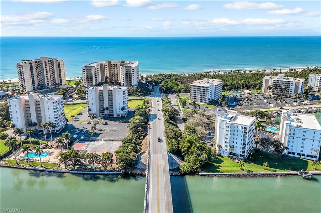21 Bluebill Avenue, Unit B503 Naples, FL 34108 - Photo 39 of 40 a view of residential houses with outdoor space