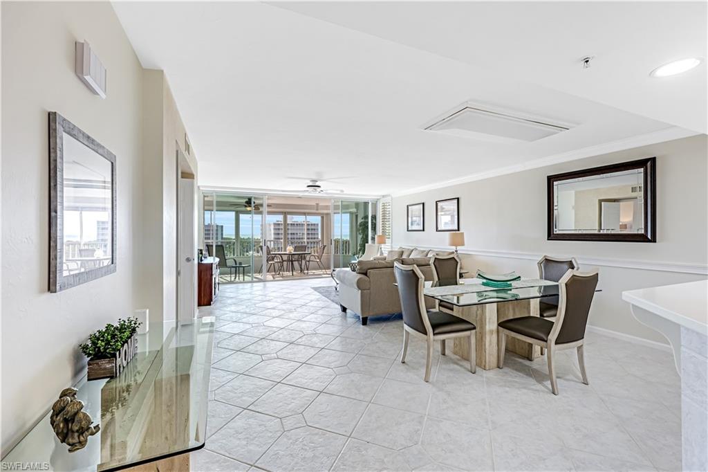21 Bluebill Avenue, Unit B503 Naples, FL 34108 - Photo 10 of 40 a living room with furniture and a potted plant