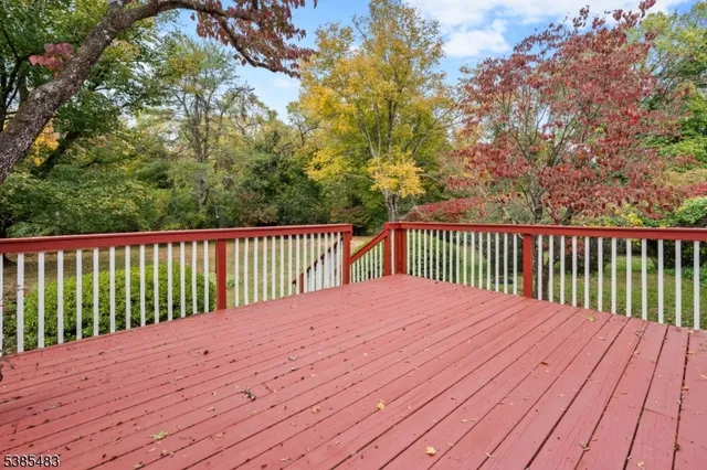a house view with a swimming pool and garden