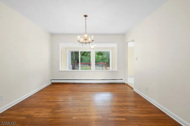 a view of a livingroom with a chandelier fan