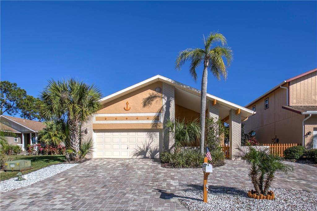 6308 Spoonbill Drive New Port Richey, FL 34652 - Photo 1 of 1 a view of a house with a yard and plants