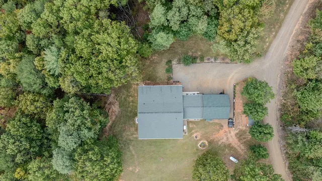 an aerial view of a yard with table and chairs