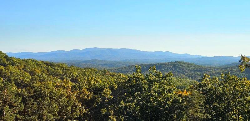 124 Cornerstone Murphy, NC 28906 - Photo 2 of 57 a view of a lush green field with a mountain in the background