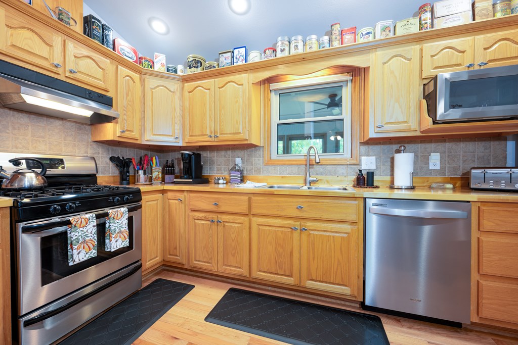 124 Cornerstone Murphy, NC 28906 - Photo 22 of 57 a kitchen with stainless steel appliances granite countertop a stove and a sink