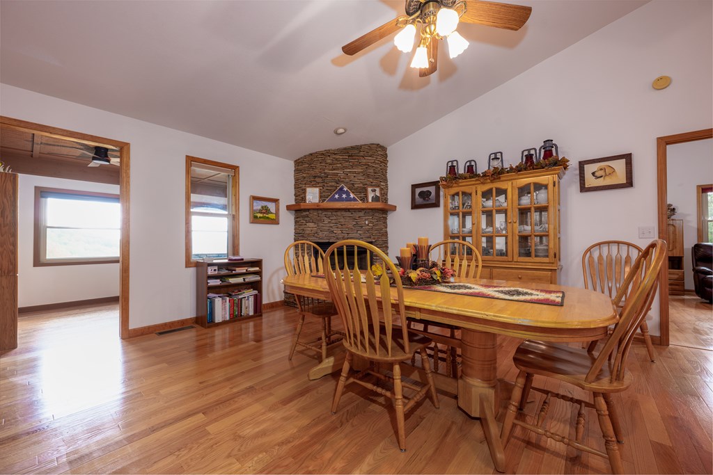 124 Cornerstone Murphy, NC 28906 - Photo 23 of 57 a view of a dining room with furniture and wooden floor