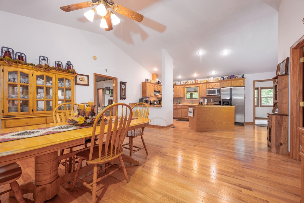 124 Cornerstone Murphy, NC 28906 - Photo 24 of 57 a view of a dining room with furniture a chandelier and wooden floor