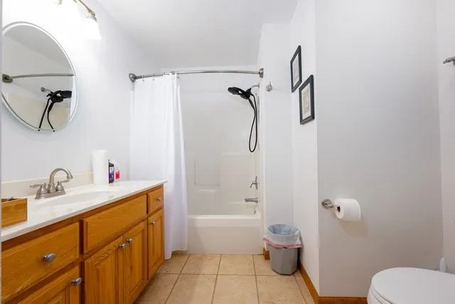 a living room with furniture a rug and a window