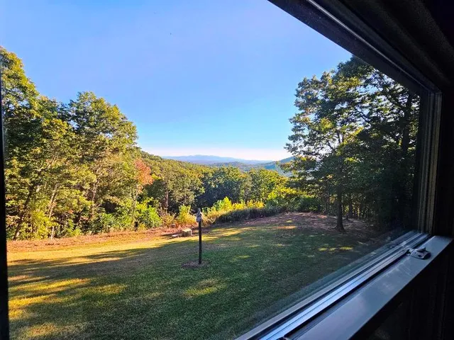 a view of a backyard of the house