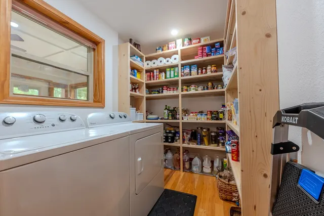 a living room with patio furniture and a large window