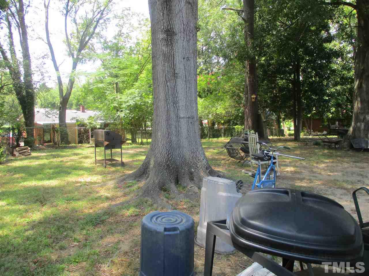 1908 Boaz Road Raleigh, NC 27610 - Photo 3 of 6 a backyard of a house with table and chairs
