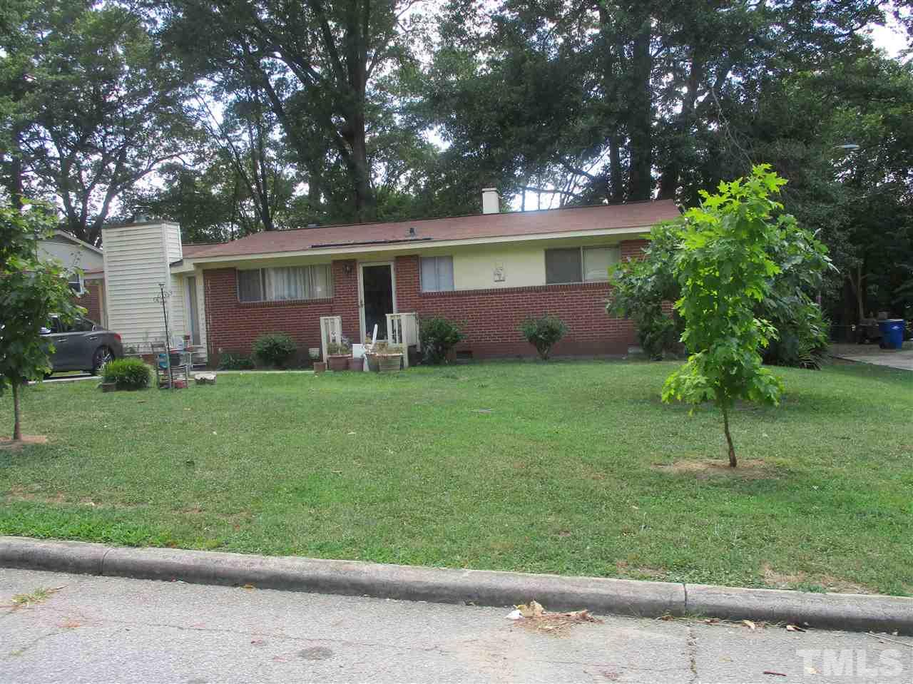 1908 Boaz Road Raleigh, NC 27610 - Photo 5 of 6 front view of a house with a yard and trees
