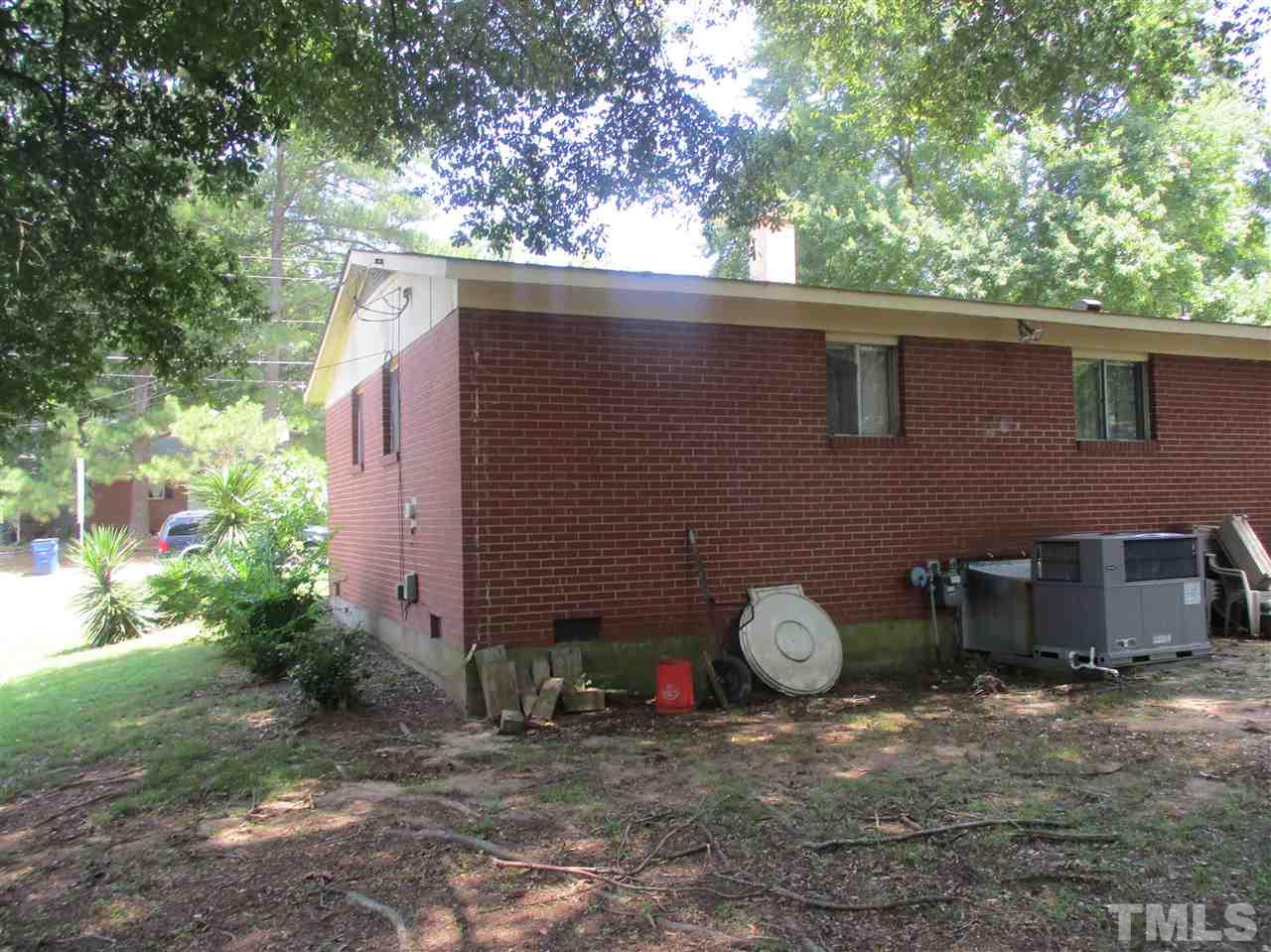 1908 Boaz Road Raleigh, NC 27610 - Photo 6 of 6 a backyard of a house with lots of green space