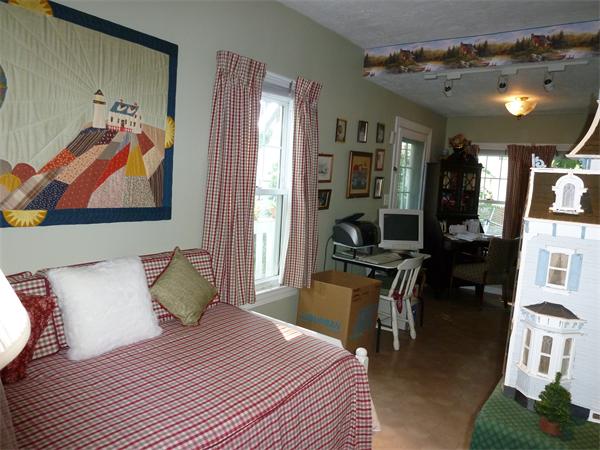 111 Larkspur Street Springfield, MA 01108 - Photo 6 of 9 a bedroom with a bed and furniture
