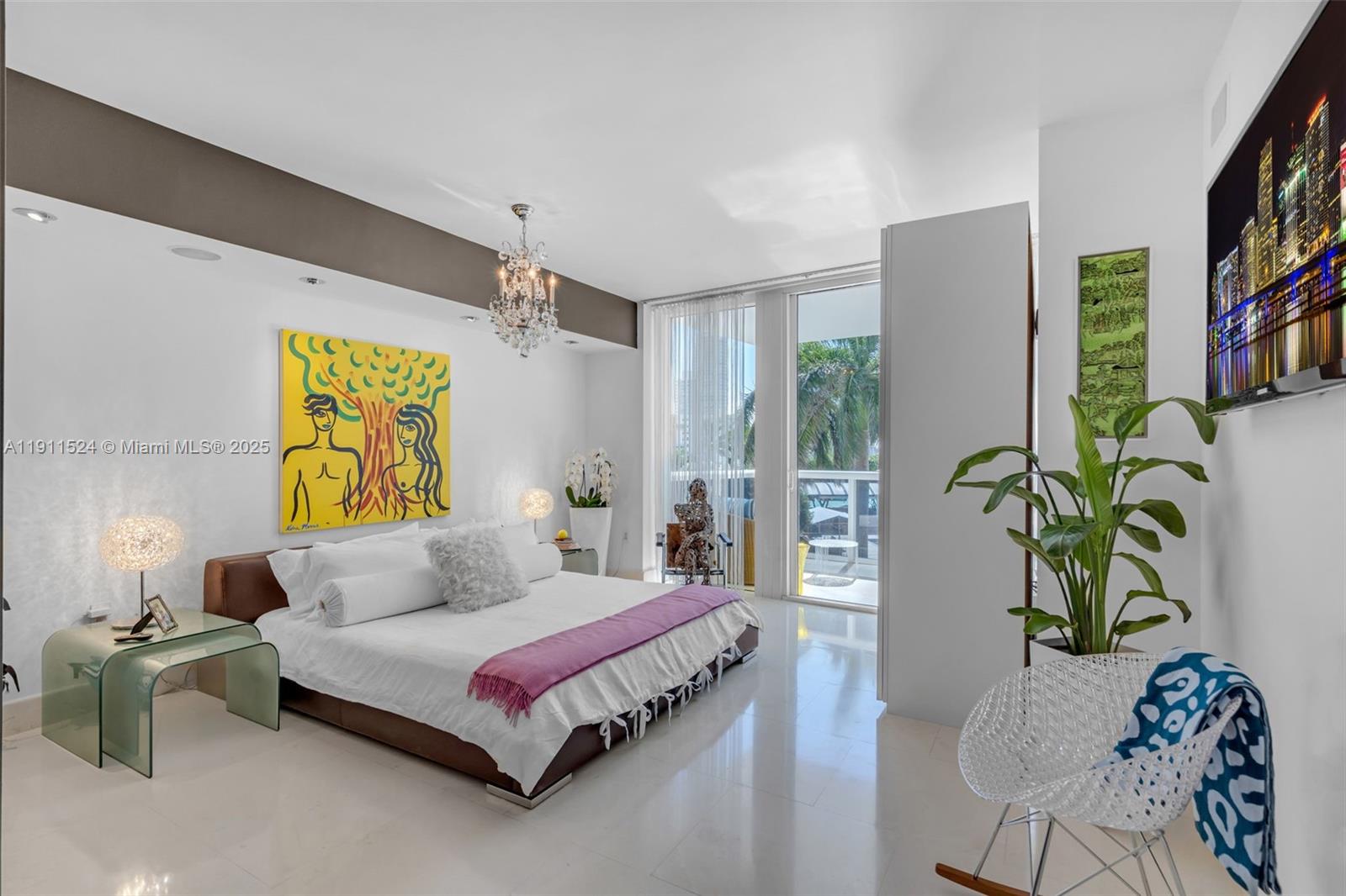 400 Alton Road, Unit 706 Miami Beach, FL 33139 - Photo 14 of 38 a spacious bedroom with a bed and a couch