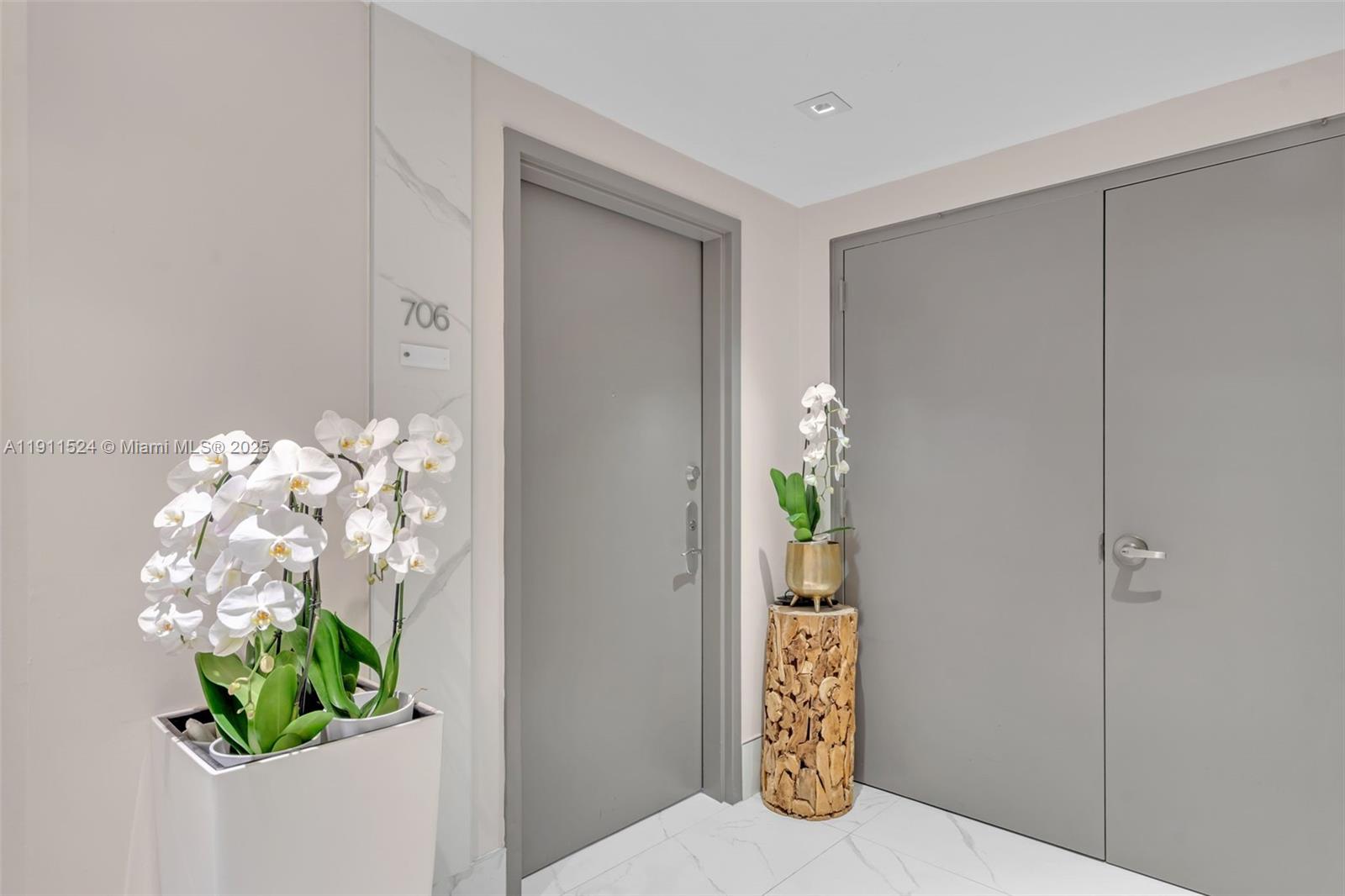 400 Alton Road, Unit 706 Miami Beach, FL 33139 - Photo 2 of 38 a view of an entryway with wooden floor