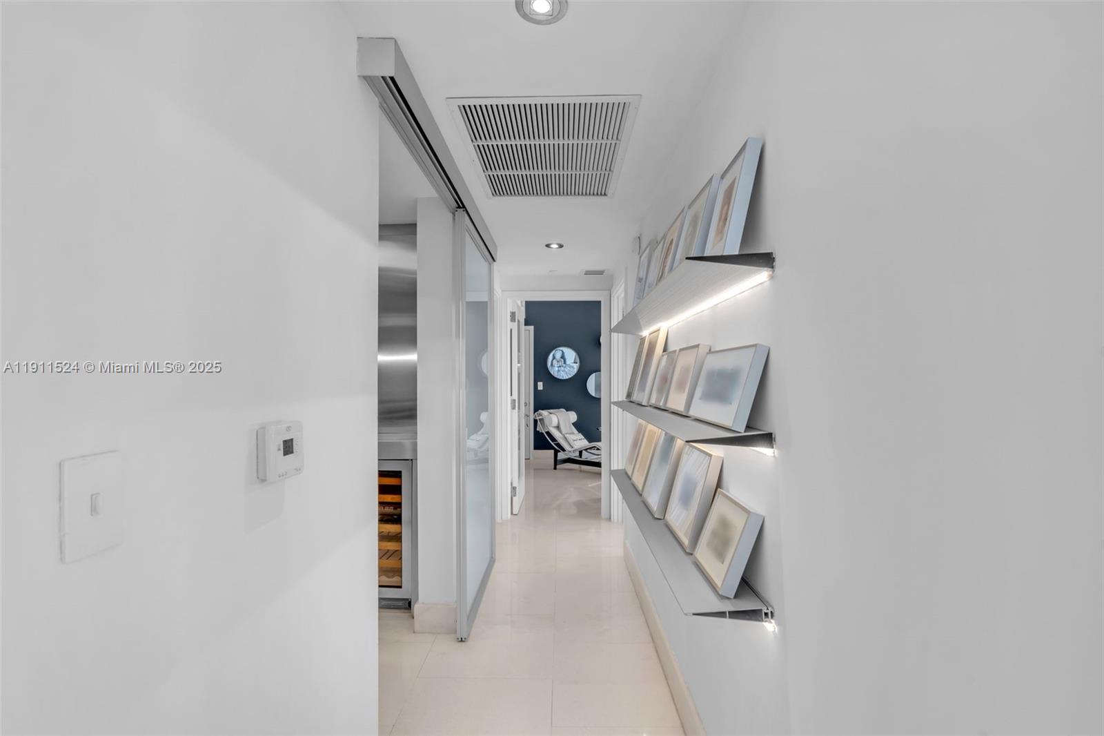 400 Alton Road, Unit 706 Miami Beach, FL 33139 - Photo 26 of 38 a view of livingroom and hallway with wooden floor