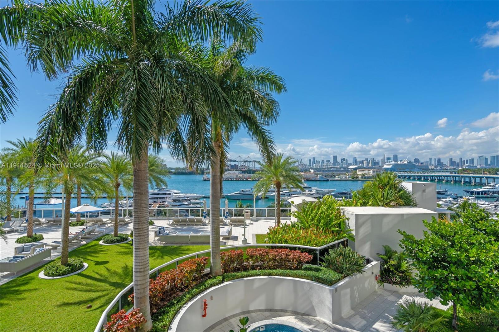 400 Alton Road, Unit 706 Miami Beach, FL 33139 - Photo 30 of 38 a view of a swimming pool with a garden
