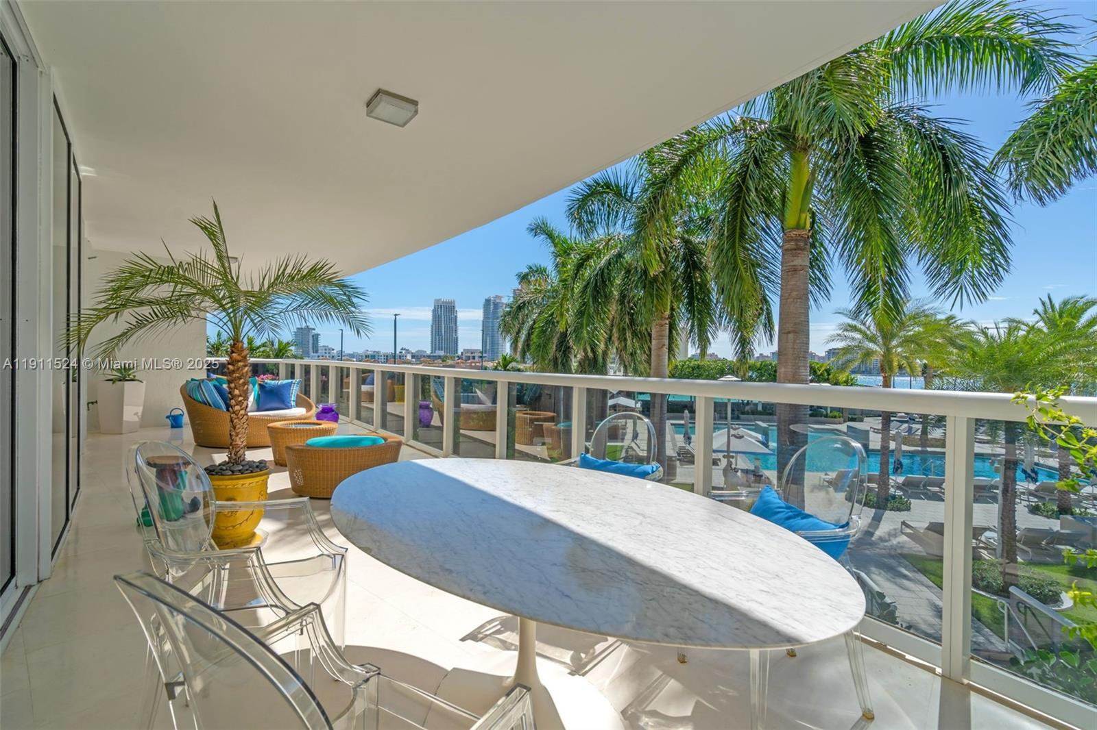 400 Alton Road, Unit 706 Miami Beach, FL 33139 - Photo 7 of 38 a view of a swimming pool with chairs