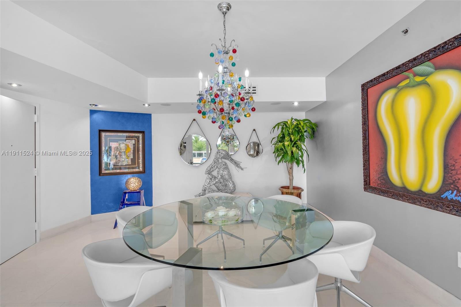 400 Alton Road, Unit 706 Miami Beach, FL 33139 - Photo 10 of 38 a dining room with furniture and chandelier