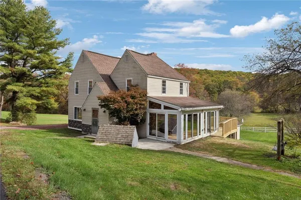 front view of a house with a yard