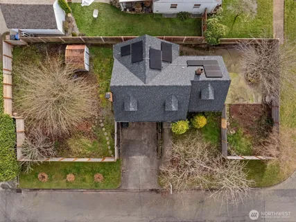 a aerial view of a house with a yard