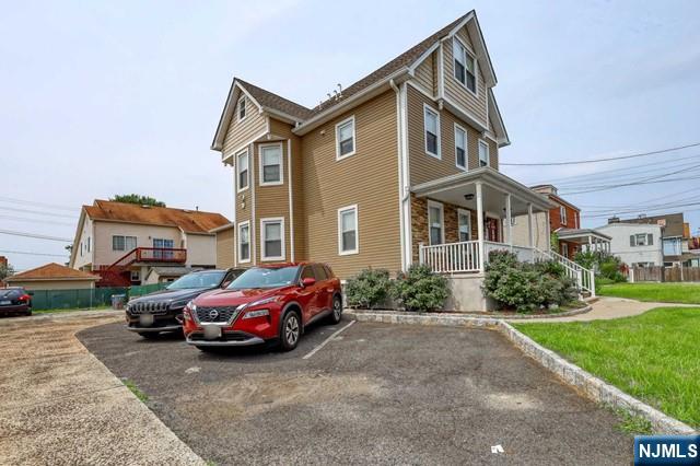407 Hudson Street, Unit 1 Hackensack, NJ 07601 - Photo 2 of 8 a car parked in front of a house