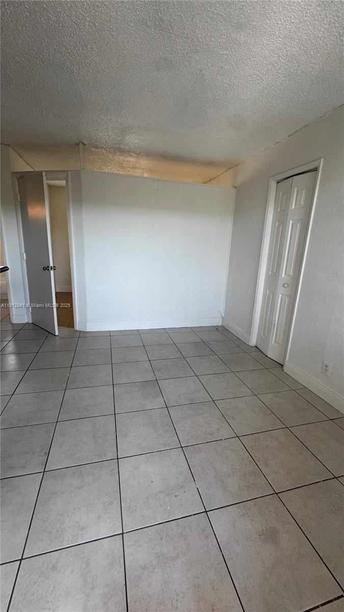4081 North Dixie Highway, Unit 20 Oakland Park, FL 33334 - Photo 2 of 7 a view of a livingroom with an empty space and a sink