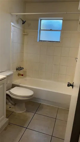 a bathroom with a toilet a sink and bathtub