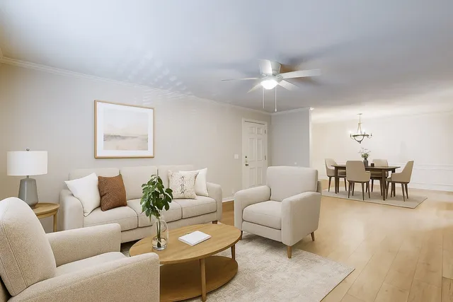 a living room with furniture and a chandelier