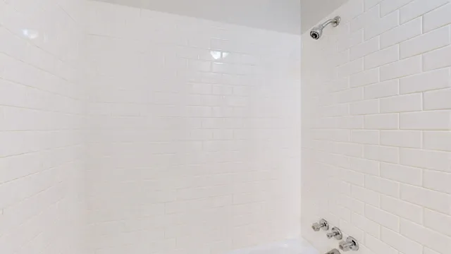 a bathroom with a sink vanity and a mirror