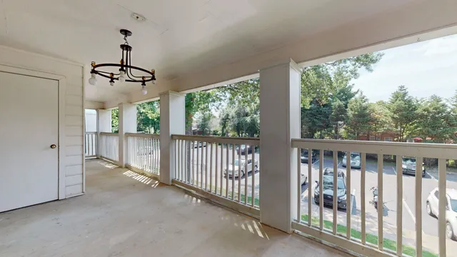 a view of a balcony with wooden floor