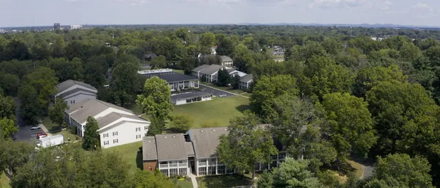 a view of a car parked in front of a house